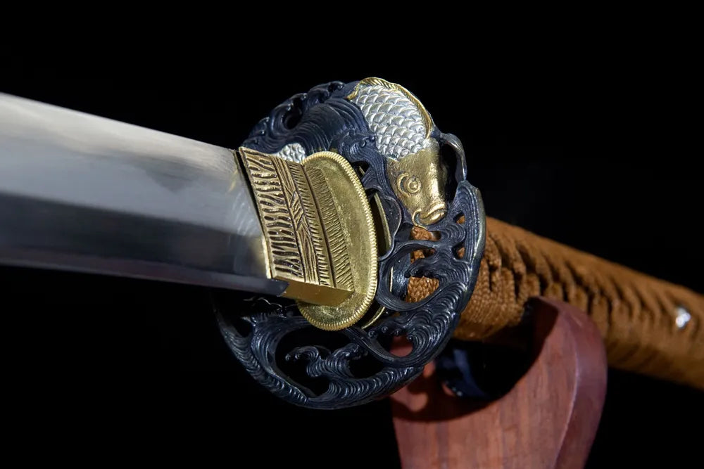 Wave koi hollow tsuba front