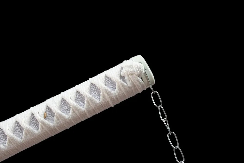 Upper grip close‑up front view white set, smooth black pommel cap detail