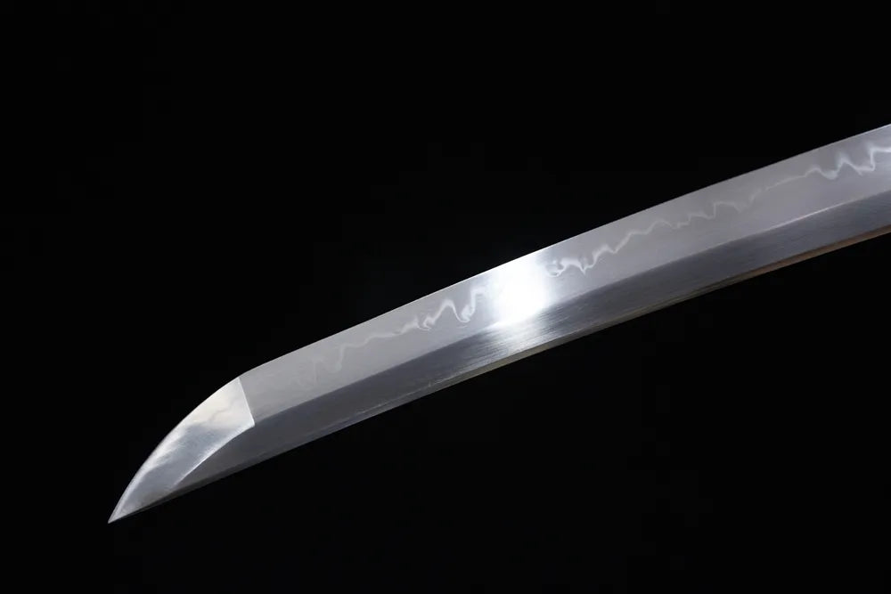 Compact functional wakizashi‑style kissaki tip of Ghost‑Of‑Tsushima matching short wakizashi blade close‑up view