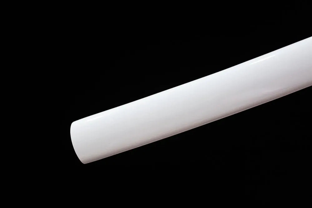 Lower section white scabbard bottom metal fitting close‑up