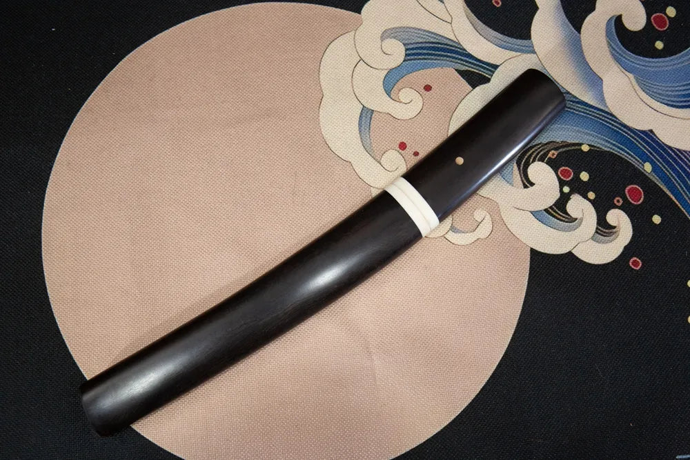 45° front view closed ebony tanto