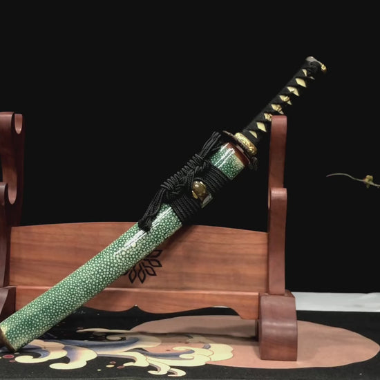 This green wakizashi has a unique hitatsura on the hamon of its blade