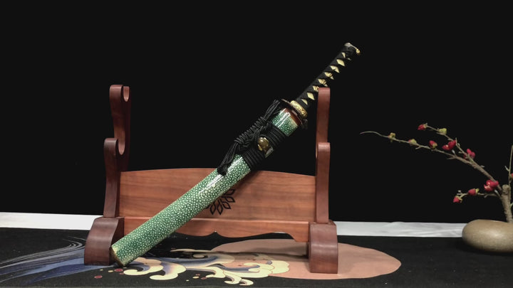 This green wakizashi has a unique hitatsura on the hamon of its blade